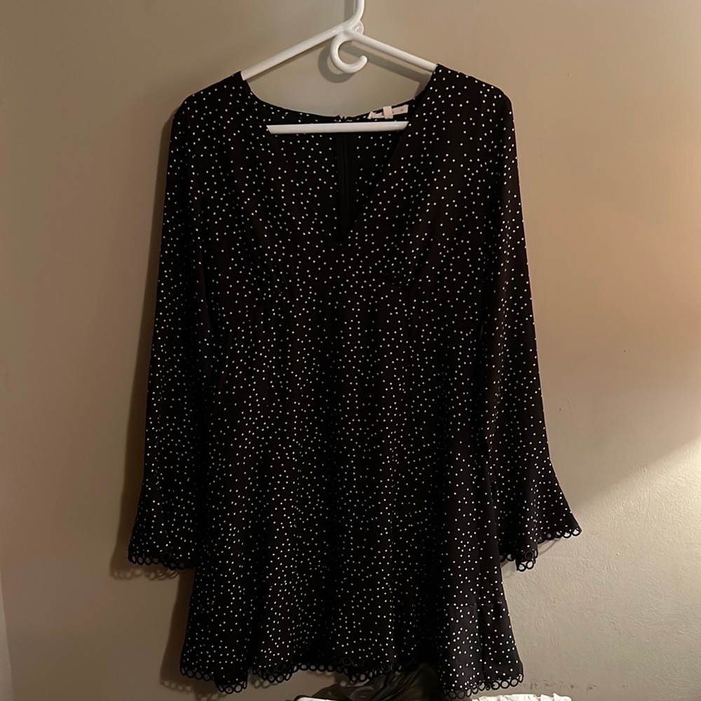Women’s Long Sleeve Black dress with white polka dots.